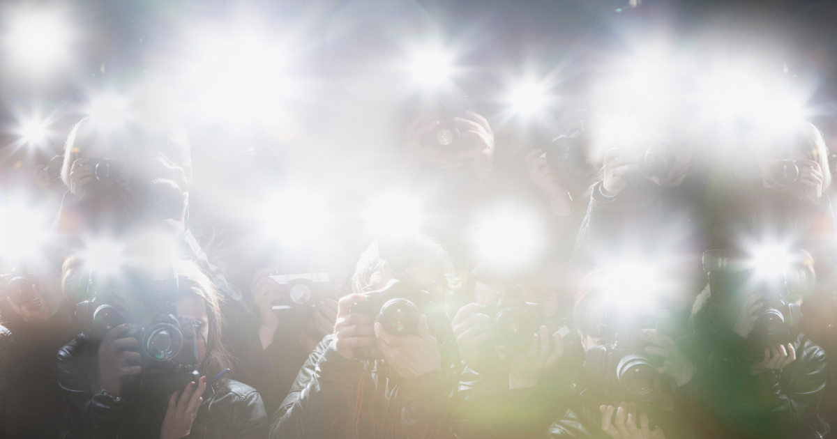 camera flashes crowd